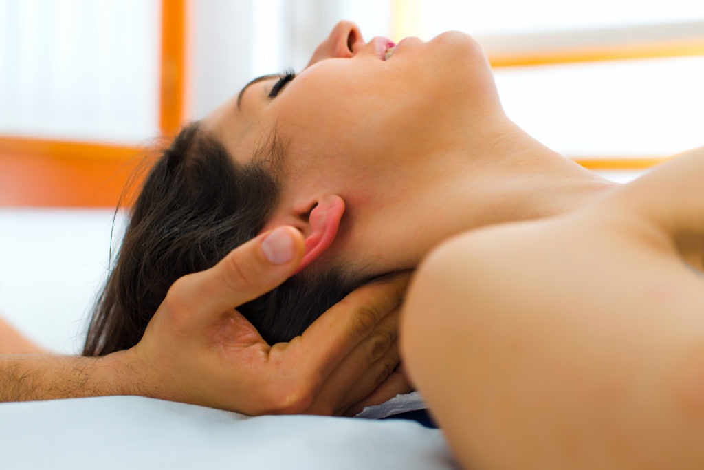 Therapist massaging the neck of woman Valley Chiropractic Sonoma